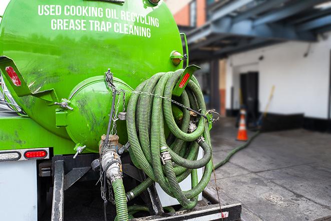 maintenance crew pumping grease trap at a fast food restaurant in Berkeley MO